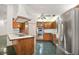 Kitchen with oak cabinets, island, and stainless steel appliances at 34620 Galla Rd, Fruitland Park, FL 34731