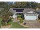 Single-story home with solar panels and landscaped yard at 3550 Auburndale Ave, The Villages, FL 32162