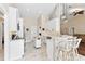 Bright kitchen with white cabinets, stainless steel appliances, and marble floors at 39320 Harbor Hills Blvd, Lady Lake, FL 32159