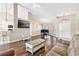 Cozy living room with hardwood floors, a decorative fireplace, and ample natural light at 39320 Harbor Hills Blvd, Lady Lake, FL 32159
