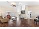 Spacious living room with hardwood floors, neutral decor, and an open layout at 39320 Harbor Hills Blvd, Lady Lake, FL 32159