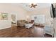 Inviting living room featuring hardwood floors, a comfortable seating area, and bright lighting at 39320 Harbor Hills Blvd, Lady Lake, FL 32159