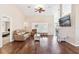 Comfortable living room with neutral tones, hardwood floors, and plantation shutters at 39320 Harbor Hills Blvd, Lady Lake, FL 32159