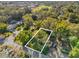 The lot outlined in white, showing close proximity to school, neighborhood, and local roads at Tbd E Jackson Ave, Mount Dora, FL 32757