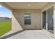 Covered patio with sliding glass door and window at Tbd S Central Ave # Parcel A, Apopka, FL 32703