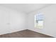 Simple bedroom with wood-look floors and window at Tbd S Central Ave # Parcel C, Apopka, FL 32703