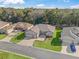 Aerial view of house with neighborhood and trees visible at 10994 Se 168Th Loop, Summerfield, FL 34491