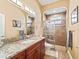 Elegant bathroom with granite countertops and a walk-in shower at 10994 Se 168Th Loop, Summerfield, FL 34491