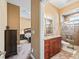 Bathroom with a large shower and granite vanity at 10994 Se 168Th Loop, Summerfield, FL 34491