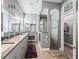 Elegant bathroom with dual vanities, large shower, and walk-in closet at 10994 Se 168Th Loop, Summerfield, FL 34491