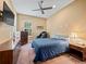 Comfortable bedroom with a queen-size bed and built-in dresser at 10994 Se 168Th Loop, Summerfield, FL 34491