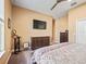 Bright bedroom with a dresser, TV, and plenty of natural light at 10994 Se 168Th Loop, Summerfield, FL 34491