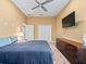 Serene bedroom with a queen-size bed and spacious closet at 10994 Se 168Th Loop, Summerfield, FL 34491
