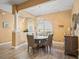 Elegant dining room featuring a wood table and neutral tones at 10994 Se 168Th Loop, Summerfield, FL 34491
