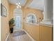 Bright entryway with tiled floors and an ornate door at 10994 Se 168Th Loop, Summerfield, FL 34491