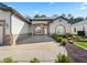 Front view of the house with a stone and stucco exterior at 10994 Se 168Th Loop, Summerfield, FL 34491