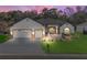 Beautiful two-car garage home with landscaping at 10994 Se 168Th Loop, Summerfield, FL 34491