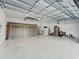 Large garage with ample storage and extra cabinets at 10994 Se 168Th Loop, Summerfield, FL 34491