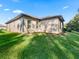 Side view of house showcasing exterior and landscaping at 10994 Se 168Th Loop, Summerfield, FL 34491