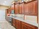 Kitchen boasts extensive cabinetry, granite counters, and built-in spice rack at 10994 Se 168Th Loop, Summerfield, FL 34491