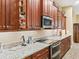 Bright kitchen with stainless steel appliances and granite countertops at 10994 Se 168Th Loop, Summerfield, FL 34491