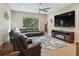 Relaxing living room with sectional sofa and electric fireplace at 10994 Se 168Th Loop, Summerfield, FL 34491
