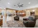 Spacious living area with a view of the kitchen and dining areas at 10994 Se 168Th Loop, Summerfield, FL 34491