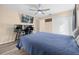 Bedroom with double bed, large TV, and workspace at 32717 Scenic Hills Drive, Mount Dora, FL 32757