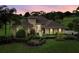 Stunning exterior elevation showcasing a meticulously landscaped front yard and inviting pathway at 39539 Harbor Hills Blvd, Lady Lake, FL 32159
