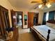 Well-lit bedroom featuring a classic bed, paneled doors, and plenty of storage space at 4060 Lake Marianna Dr, Winter Haven, FL 33881