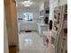 Spacious kitchen featuring white cabinets, countertops, a window over the sink, and marble-patterned tile flooring at 4060 Lake Marianna Dr, Winter Haven, FL 33881