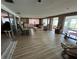 Open living room featuring a seamless transition to the sunroom and comfortable seating at 4060 Lake Marianna Dr, Winter Haven, FL 33881