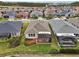 Aerial view of home with screened patio and landscaping at 537 Narrow View Ln, Groveland, FL 34736