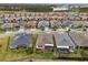 Aerial view of homes with backyard patios and landscaping at 537 Narrow View Ln, Groveland, FL 34736
