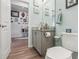 Small bathroom with toilet and granite vanity at 537 Narrow View Ln, Groveland, FL 34736