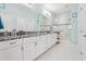 Elegant bathroom with double vanity, granite countertop, and large shower at 537 Narrow View Ln, Groveland, FL 34736