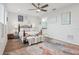 Spacious Primary bedroom with hardwood floors and ensuite bathroom access at 537 Narrow View Ln, Groveland, FL 34736