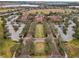 Community clubhouse with parking and manicured lawn at 537 Narrow View Ln, Groveland, FL 34736