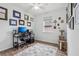 Bright home office features built-in desk, window, and wood-look floors at 537 Narrow View Ln, Groveland, FL 34736