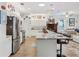 Spacious kitchen, stainless steel appliances, and breakfast bar at 537 Narrow View Ln, Groveland, FL 34736