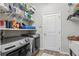 Laundry room with washer, dryer, and ample shelving at 537 Narrow View Ln, Groveland, FL 34736