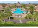 Large community pool with surrounding lounge chairs at 537 Narrow View Ln, Groveland, FL 34736
