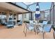 Outdoor patio with seating for dining and grilling at 537 Narrow View Ln, Groveland, FL 34736