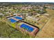 Community tennis courts with surrounding landscaping at 537 Narrow View Ln, Groveland, FL 34736