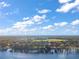 Scenic aerial view of the neighborhood with distant lake view, showcasing the community's tranquil setting at 5415 Banana Point Dr, Okahumpka, FL 34762