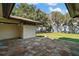 Outdoor patio area looking onto backyard lawn with lake views at 5415 Banana Point Dr, Okahumpka, FL 34762