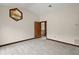Bedroom featuring an interesting accent window and an open doorway to an upper level at 5415 Banana Point Dr, Okahumpka, FL 34762