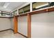 Walk-in closet with wooden rods and shelves for optimal storage at 5415 Banana Point Dr, Okahumpka, FL 34762