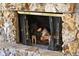 Cozy stone fireplace adds warmth and charm to the living space, perfect for relaxing on chilly evenings at 5415 Banana Point Dr, Okahumpka, FL 34762