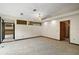 The carpeted living room has recessed lights and a modern light fixture at 5415 Banana Point Dr, Okahumpka, FL 34762